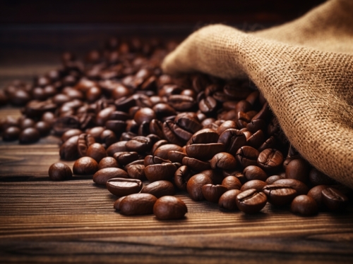 roasted coffee beans on a brown wooden 000