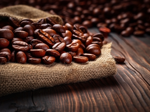 roasted coffee beans on a brown wooden 001